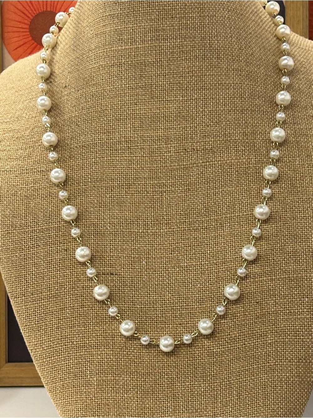 Faux pearl gold tone station necklace